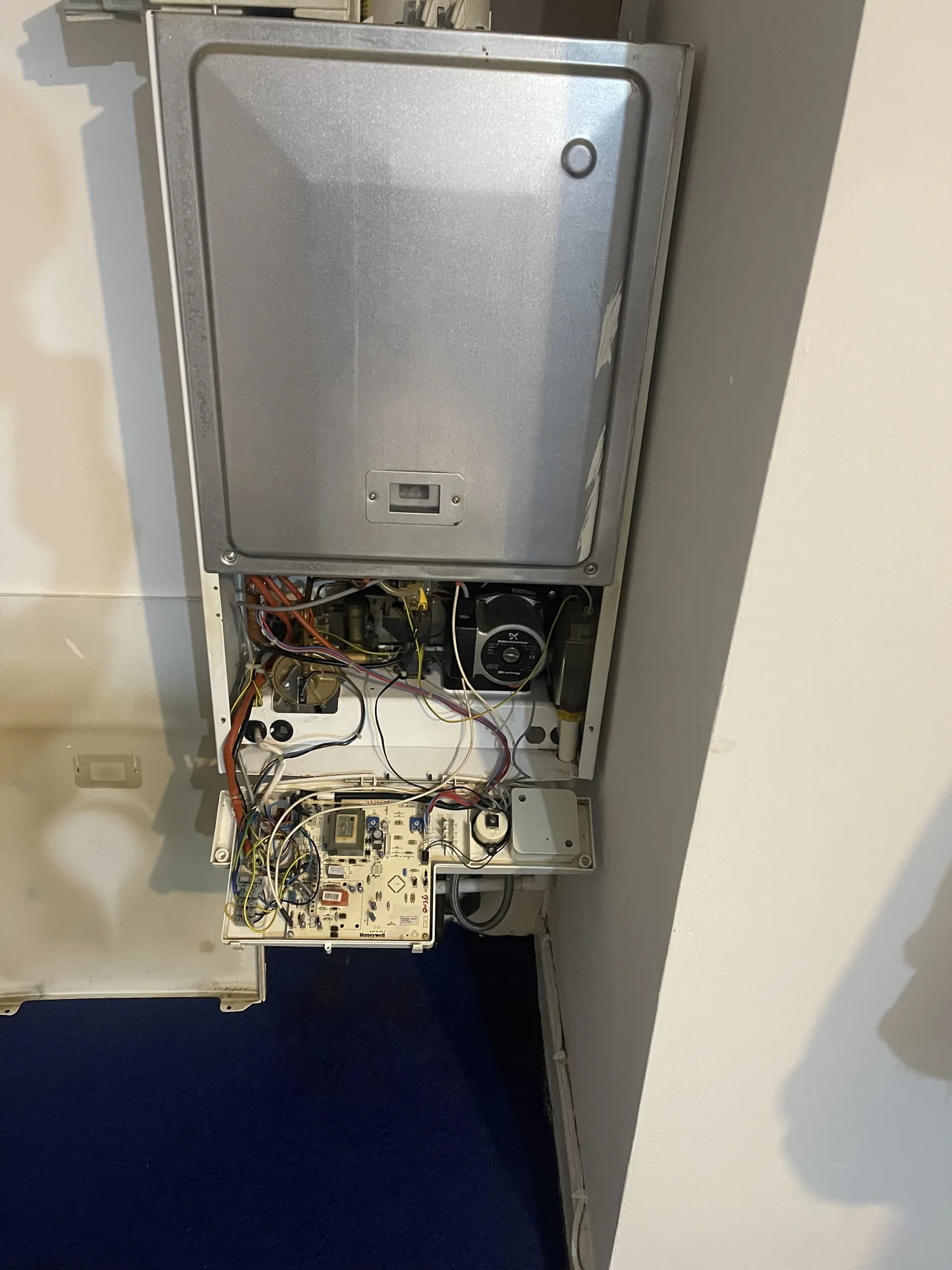Older boiler with the casing removed for fault diagnosis