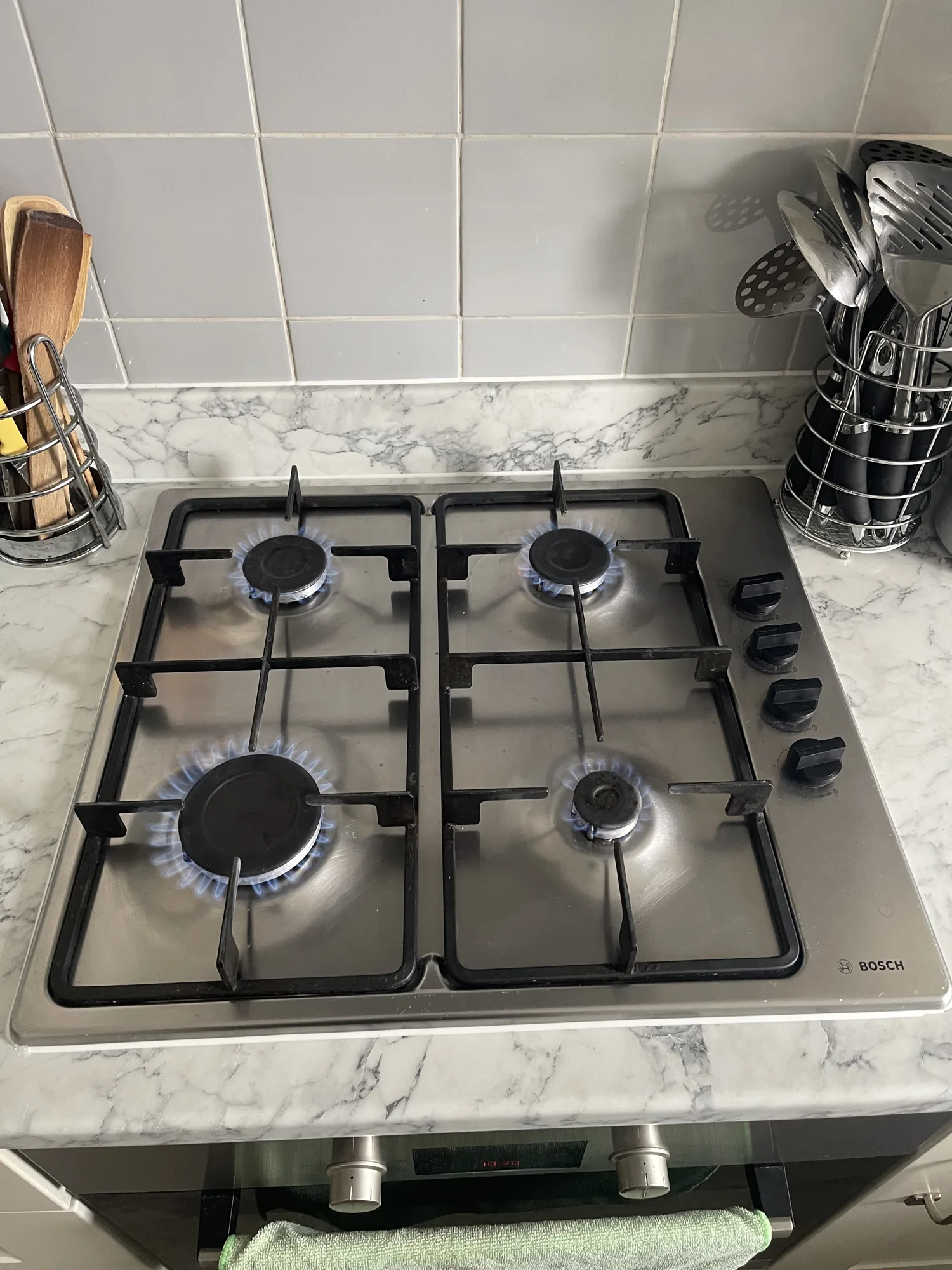 Four-burner gas hob lit and working after installation