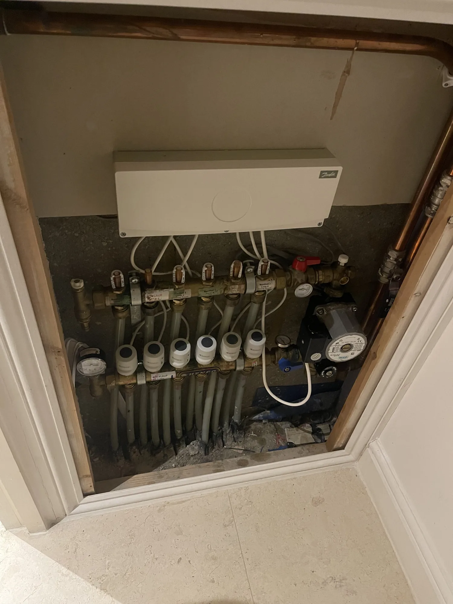 Underfloor heating manifold and pipework